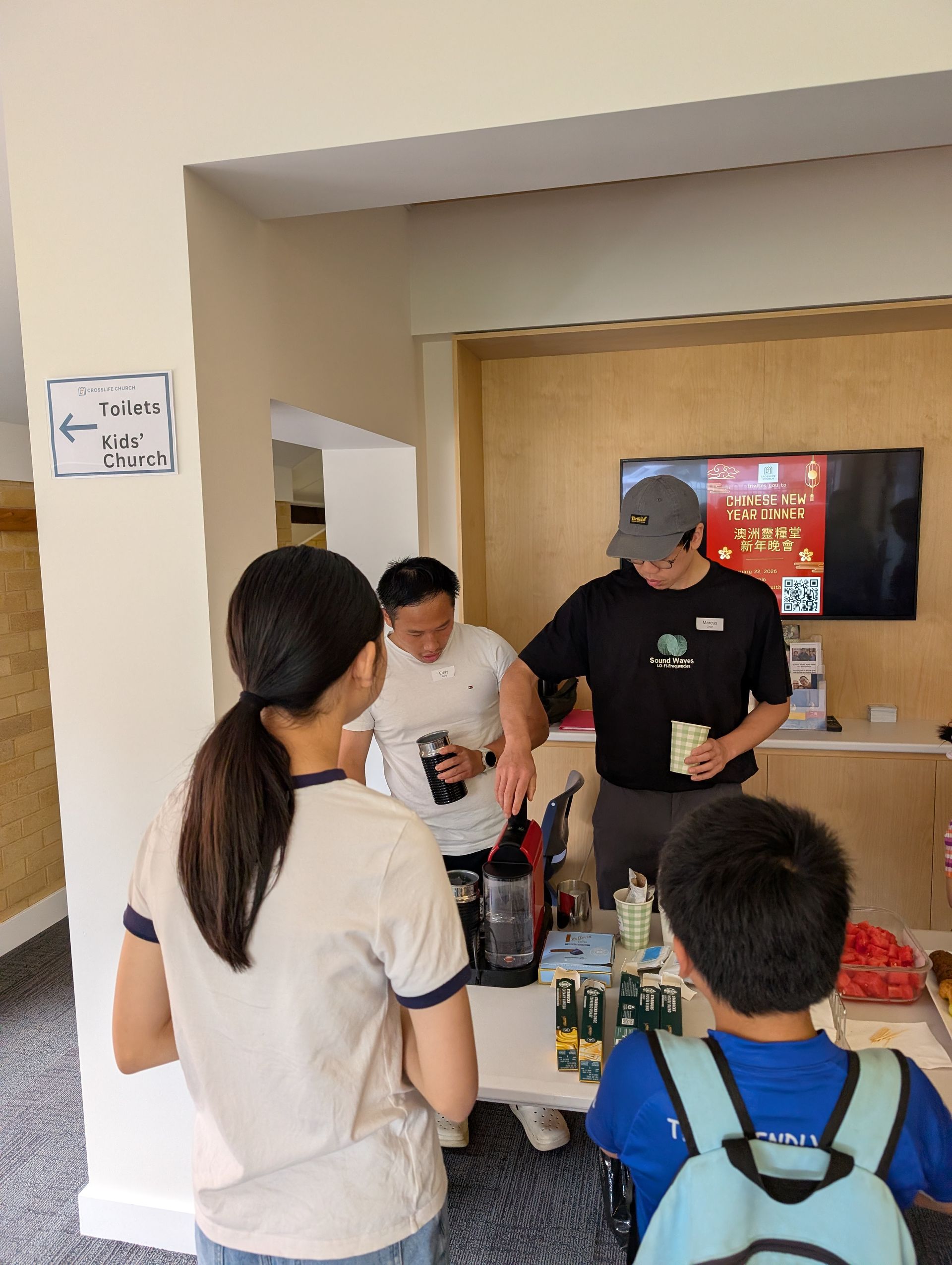 Volunteers serving coffee after the Sunday service