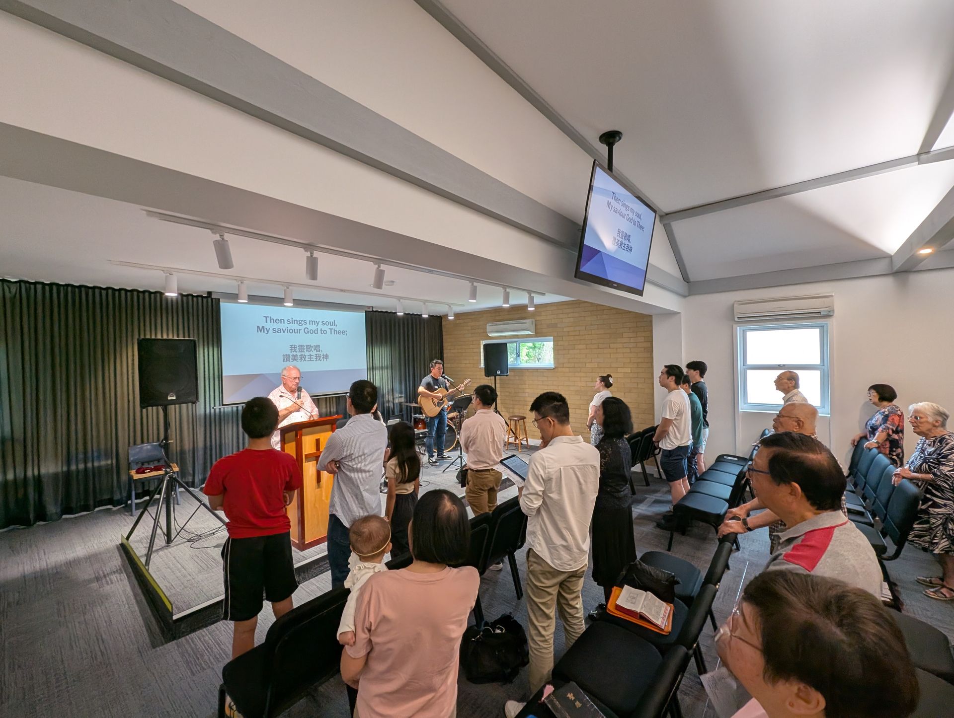 Congregation singing during Sunday worship at CrossLife Church